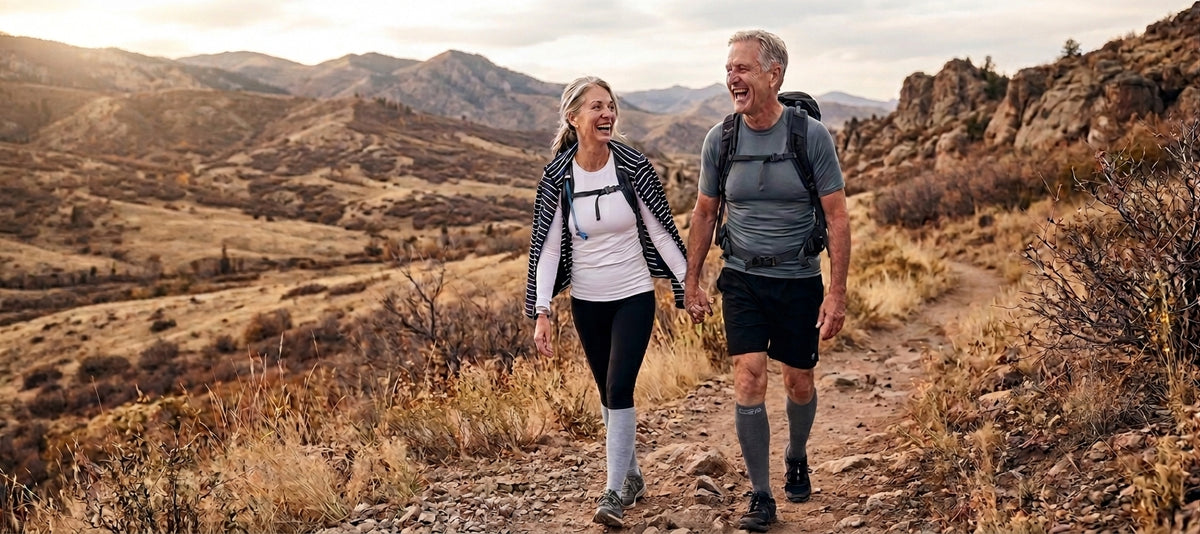 Couple hiking outdoors wearing Comfort2Prime compression socks